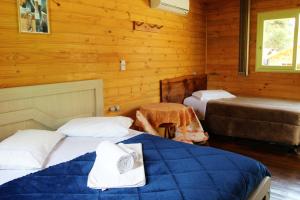 Cama ou camas em um quarto em Pousada Oliveira - Cambara do Sul-RS