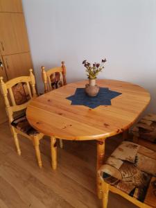 a wooden table with a star on it in a room at Снежанка in Pamporovo