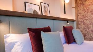 Postel nebo postele na pokoji v ubytování JovA Hotel Boutique