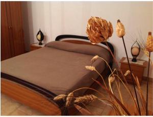 Llit o llits en una habitació de B&B Via dei Trulli