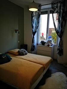 Katil atau katil-katil dalam bilik di Appartement proche stations de ski et thermales