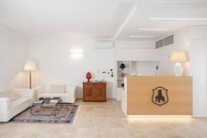a living room with a couch and a table at Masseria Mongiò dell'Elefante in Otranto