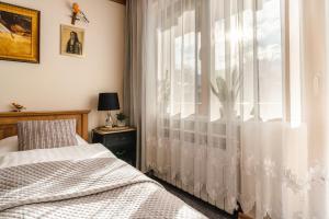 Łóżko lub łóżka w pokoju w obiekcie Górski klimat Apartament
