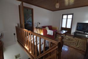 Televízia a/alebo spoločenská miestnosť v ubytovaní St. John Traditional House