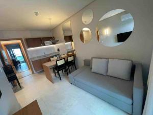 a living room with a couch and a table at Salinas Exclusive Resort in Salinópolis