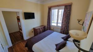 Postel nebo postele na pokoji v ubytování Chocolate Manor House Hotel Boutique
