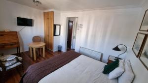 Postel nebo postele na pokoji v ubytování Chocolate Manor House Hotel Boutique