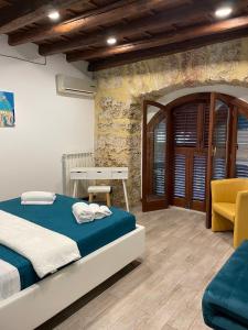 Postel nebo postele na pokoji v ubytování Posto al Capo