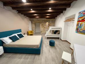 En eller flere senger på et rom på Posto al Capo