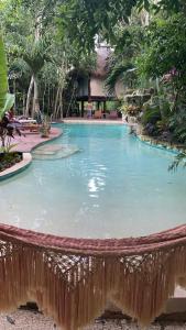 a large pool with water in a resort at Xoot Ka’Ana villa fantasía in Bacalar