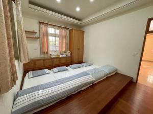Postel nebo postele na pokoji v ubytování Shinchen 88 Villa