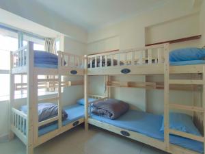 Palanda nebo palandy na pokoji v ubytování 都市小憩青旅 + 26 fotografií