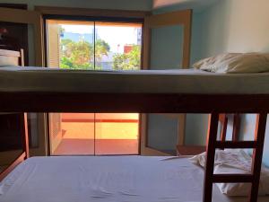 Ένα ή περισσότερα κρεβάτια σε δωμάτιο στο La Casa de Pedro Hostel