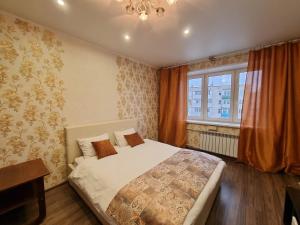 Vuode tai vuoteita majoituspaikassa Apartment Avrora, Komsomolskaya 89