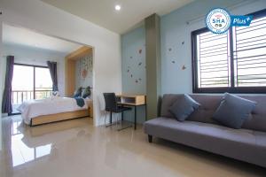 Area soggiorno di Sirimunta Hotel Chiang Rai Suite & Residence