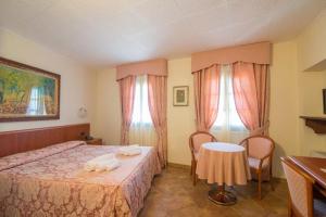 Letto o letti in una camera di Albergo Giardino