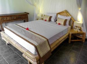 Giường trong phòng chung tại Villa Senang Senggigi