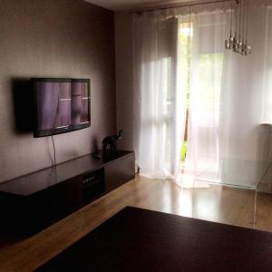 a living room with a flat screen tv on a wall at Apartament ''Cleopatra 2'' z garazem, faktury VAT in Kielce