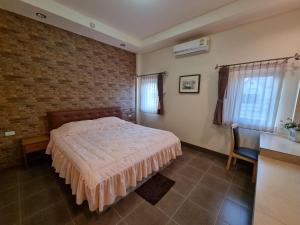 Voodi või voodid majutusasutuse Kireeya Villa toas