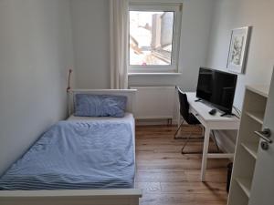 Ένα ή περισσότερα κρεβάτια σε δωμάτιο στο Gästehaus Iwwerdorfer Hof
