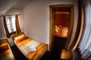 Posteľ alebo postele v izbe v ubytovaní Horský Hotel Sněženka