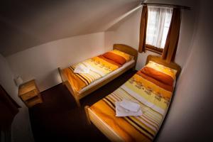 Posteľ alebo postele v izbe v ubytovaní Horský Hotel Sněženka