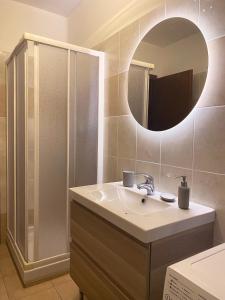 a bathroom with a sink and a mirror at Maison Claudio CIR VDA-AOSTA- n 0202 in Aosta