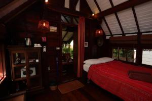 Tempat tidur dalam kamar di Le Passe-Temps