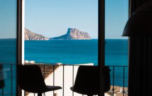 a view of the ocean from a hotel room at Porta Nova Suites - Room Breakfast & Sea View in Altea