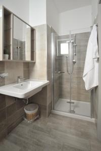 a bathroom with a sink and a shower at Agriturismo San Raphael in Capaccio-Paestum