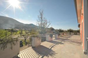 a balcony of a house with a view of a mountain at Agriturismo San Raphael in Capaccio-Paestum