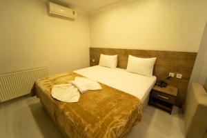A bed or beds in a room at Zin Hotel İstanbul
