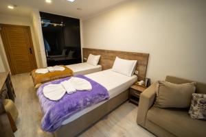 A bed or beds in a room at Zin Hotel İstanbul