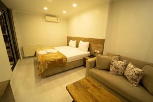 A bed or beds in a room at Zin Hotel İstanbul