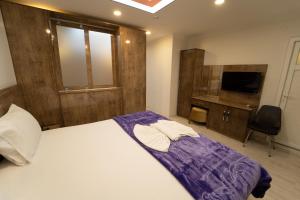 A bed or beds in a room at Zin Hotel İstanbul