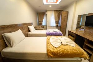 A bed or beds in a room at Zin Hotel İstanbul