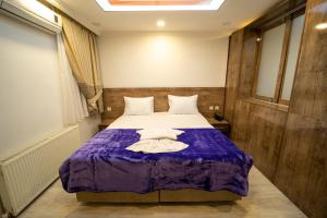 A bed or beds in a room at Zin Hotel İstanbul