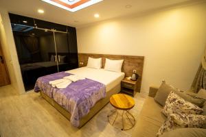 A bed or beds in a room at Zin Hotel İstanbul