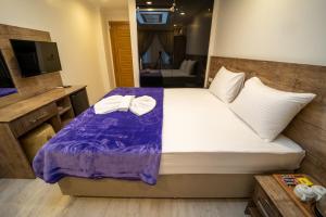 A bed or beds in a room at Zin Hotel İstanbul