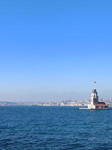 a large body of water with a lighthouse in the distance at single room, in Üsküdar in Istanbul