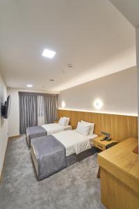 Кровать или кровати в номере Asli Makon Hotel