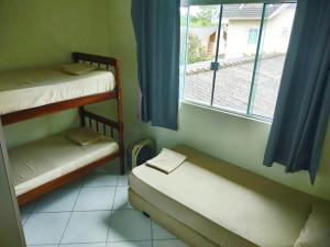 Säng eller sängar i ett rum på Amplo Apartamento na Pinheira