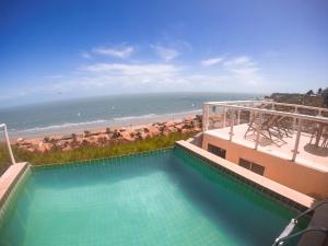 A view of the pool at Chalés Mirante do Mar or nearby