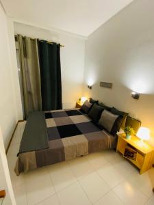 A bed or beds in a room at Apartments Plaza Mayor