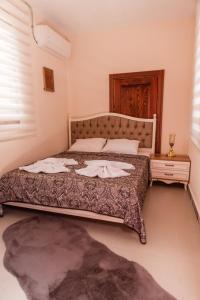 Ein Bett oder Betten in einem Zimmer der Unterkunft Lily Town Boutique Hotel