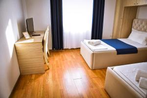 Postel nebo postele na pokoji v ubytování Hotel Jurgen