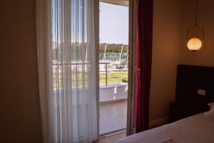 Postel nebo postele na pokoji v ubytování Hotel Jurgen