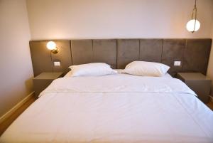 Postel nebo postele na pokoji v ubytování Hotel Jurgen