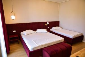 Postel nebo postele na pokoji v ubytování Hotel Jurgen