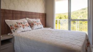 Ένα ή περισσότερα κρεβάτια σε δωμάτιο στο Recanto da Gracieli +16 φωτογραφίες